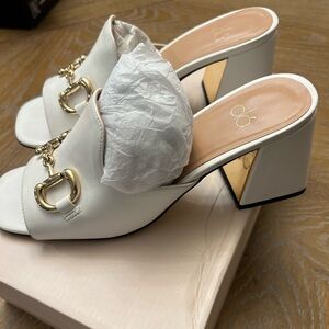 Size 8 white block heel shoes with gold hardware.